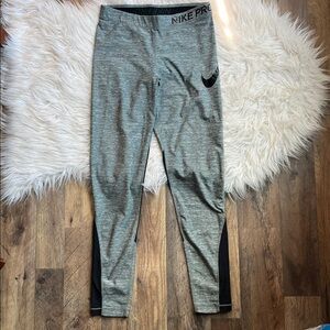 Nike Pro Dri-FIT mid-rise mesh-paneled women's leggings in gray and black size M